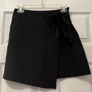 Suede black skirt with tie bow